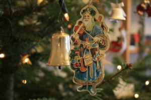 Vintage Santa Claus ornament hanging on a Christmas tree