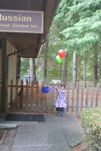 Polina swinging her lunch bag.