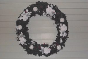 Christmas wreath with white flowers.