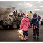 Children salute Ukrainian tanks rolling by